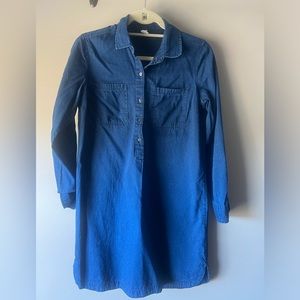 Denim dress, dark wash. Buttons only midway up, not all the way down.